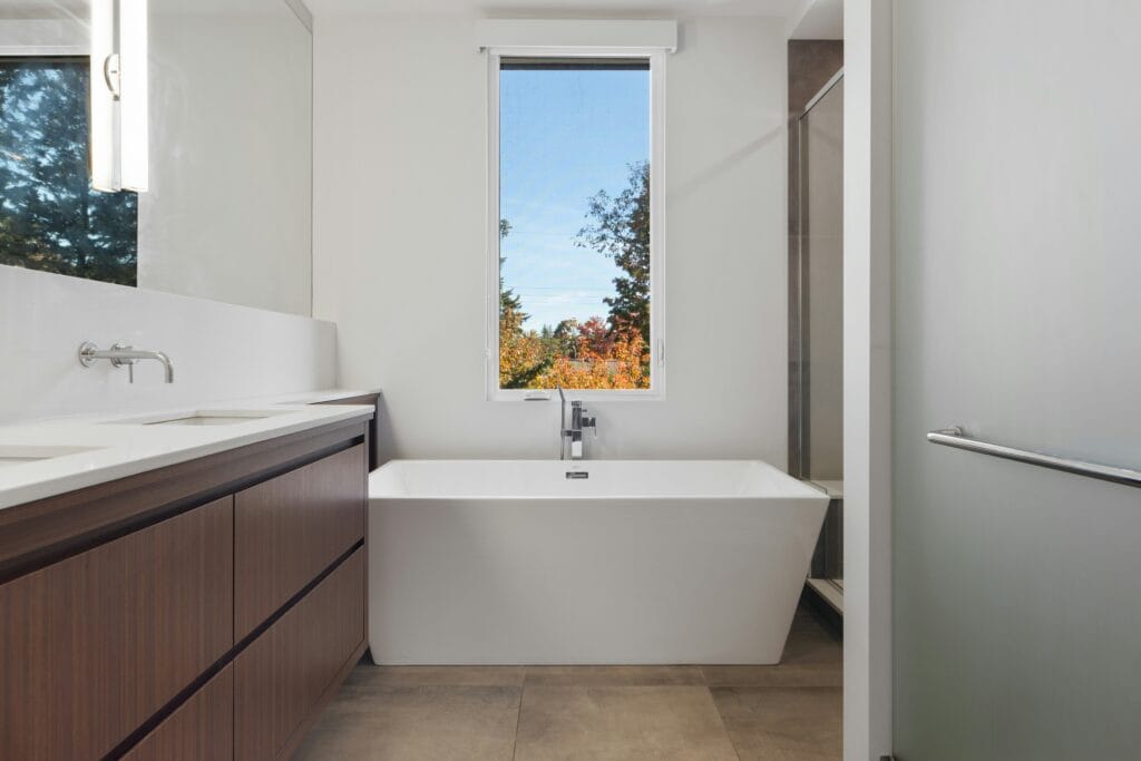 A Bright Bathroom With A Sleek Pocket Door Installed