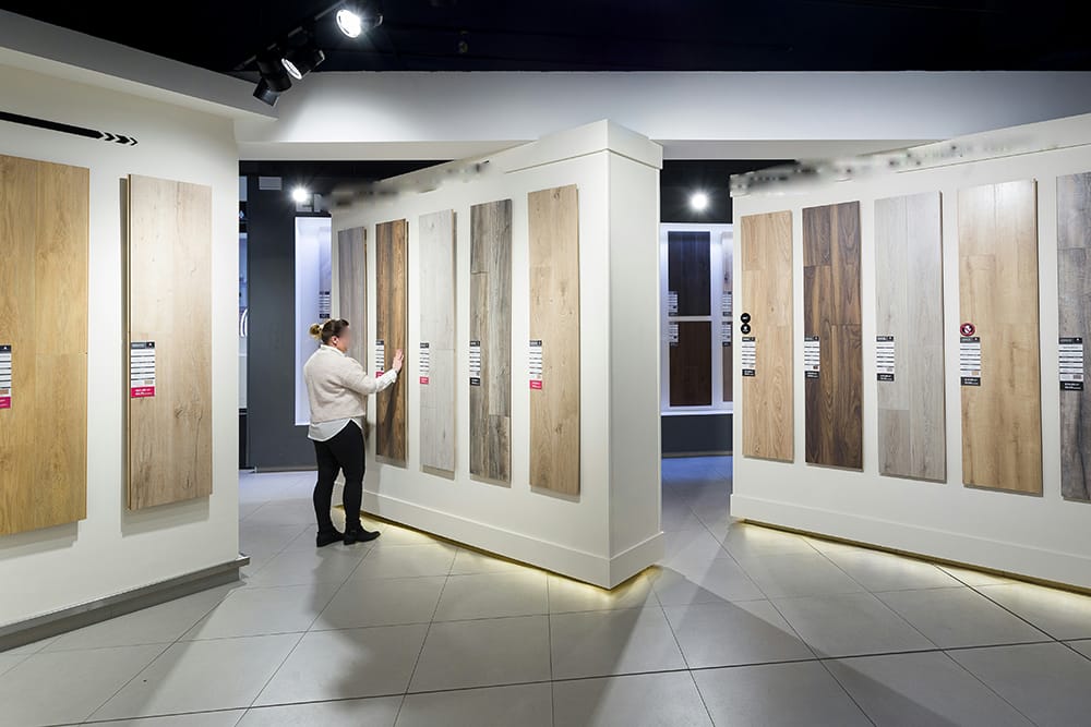 Various Pocket Door Styles And Materials Displayed In A Showroom